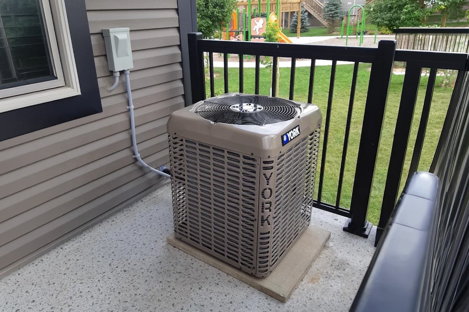 High-efficiency York air conditioner replacement completed in a Waterloo balcony.
