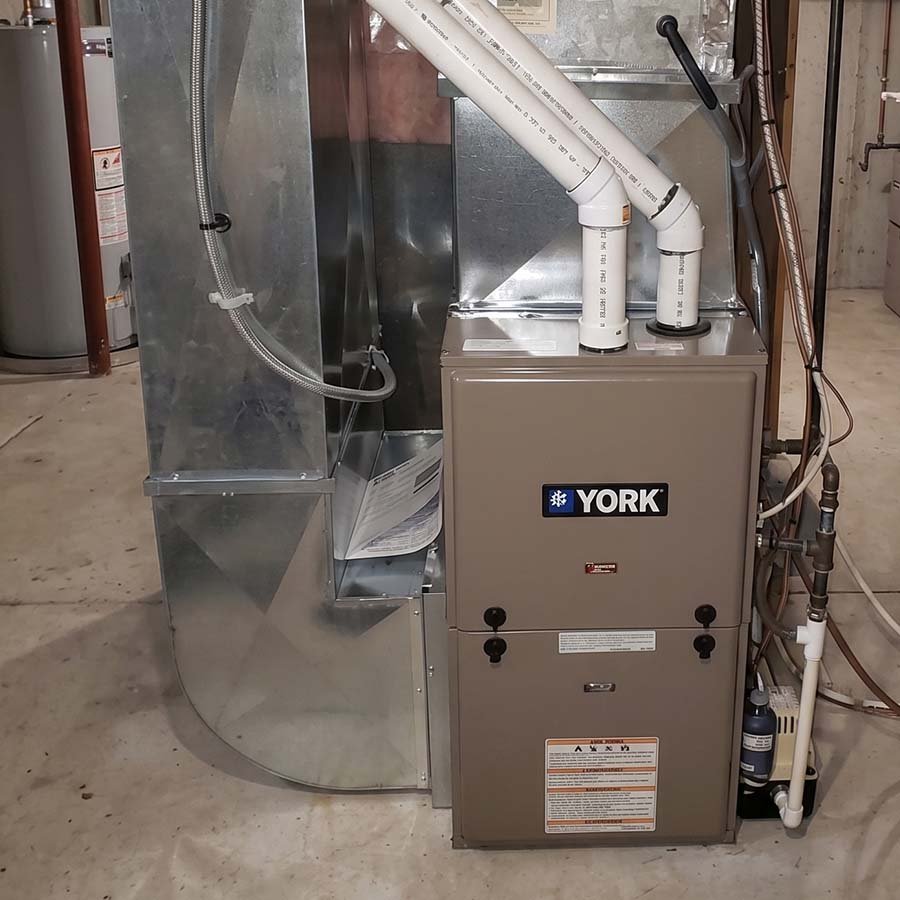 High-efficiency York gas furnace installed in a residential basement in Kitchener, Ontario.