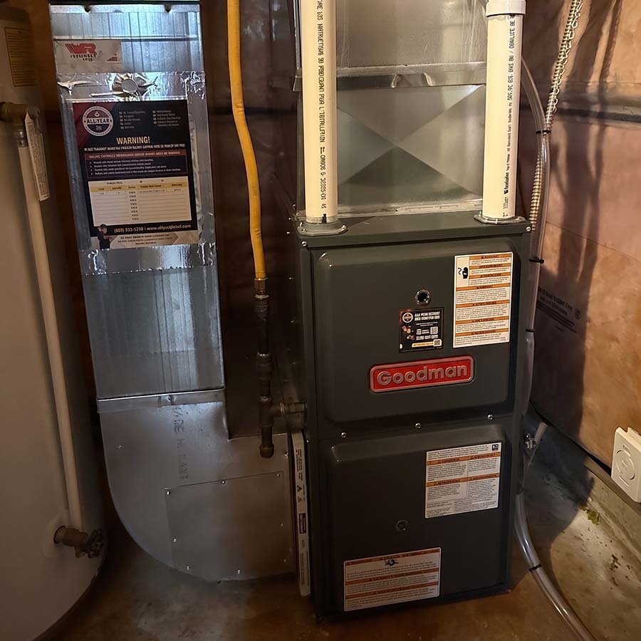 A modern, energy-efficient gas furnace installed neatly in a Waterloo basement.