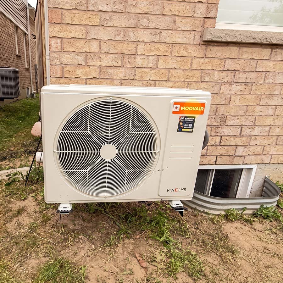 A compact side-discharge Moovair heat pump unit providing space-saving, energy-efficient heating and cooling to a Waterloo home.
