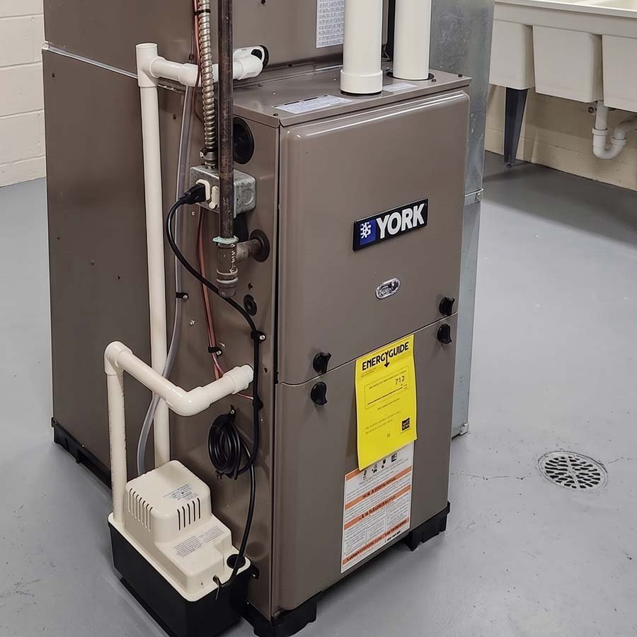 Professional high-efficiency York furnace installation in a Kitchener mechanical room.